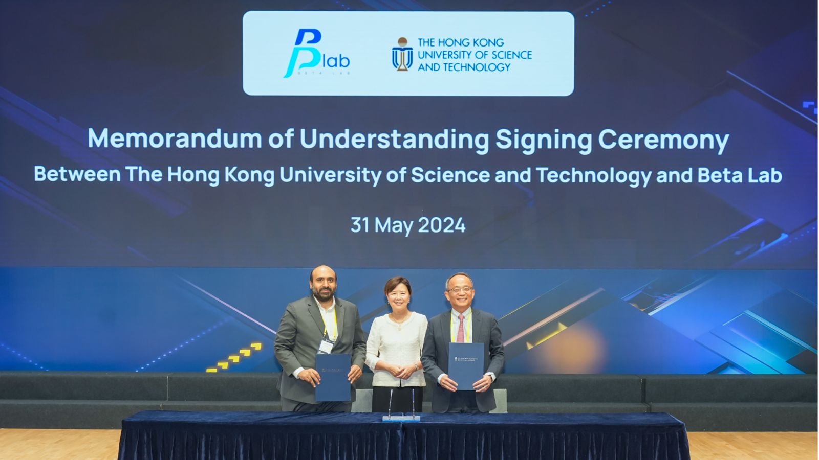 President of the Hong Kong University of Science and Technology Nancy Ip Yuk-yu (center) poses with Beta Lab CEO Abdulrahman Alolayan (left) and HKUST Vice-President for Research and Development Tim Cheng Kwang-ting (right) after the signing of cooperation agreements and memorandums of understanding on May 31, 2024. (PROVIDED TO CHINA DAILY)